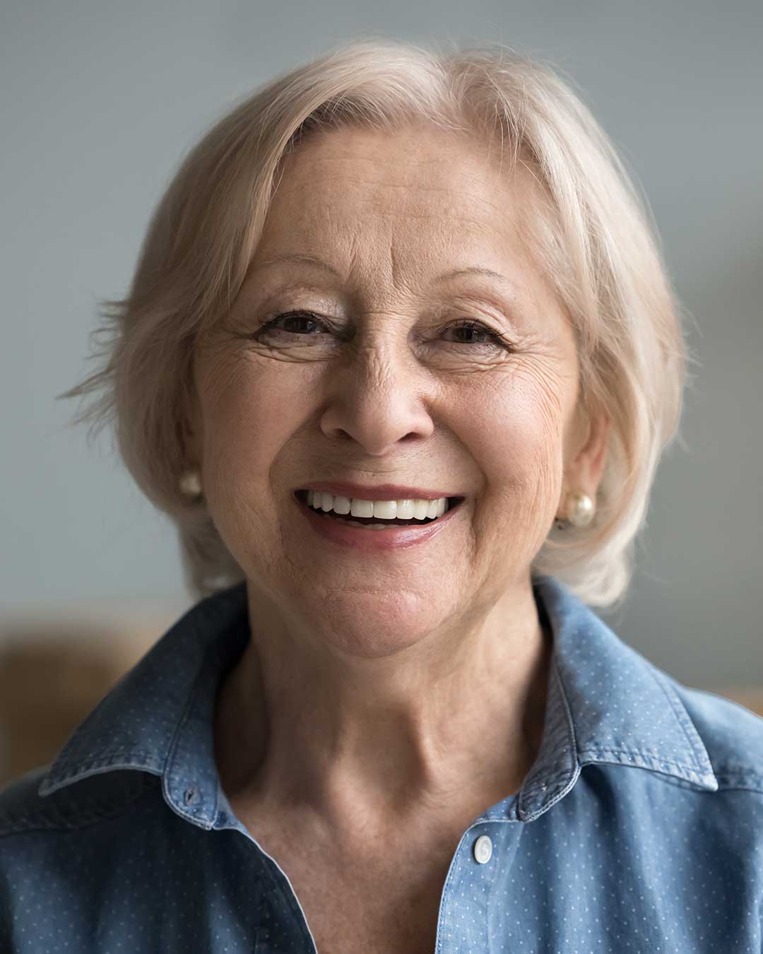 Lovely elderly woman with a smile restored with full dentures