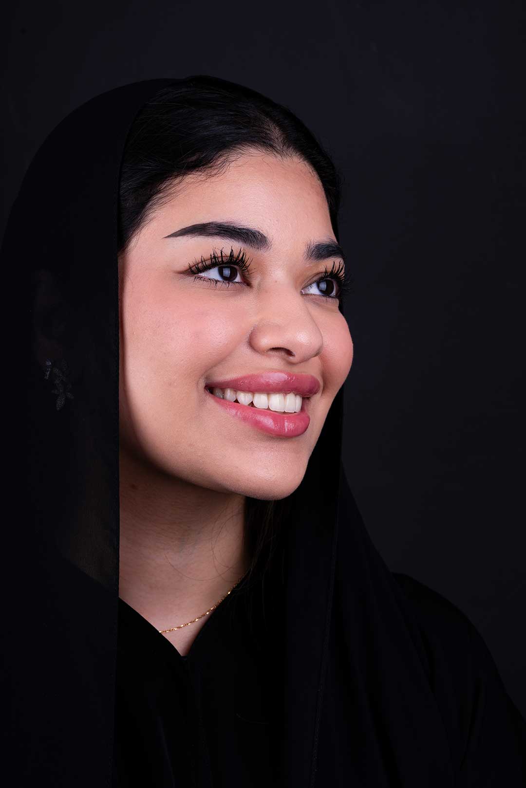 Confident woman smiles confidently