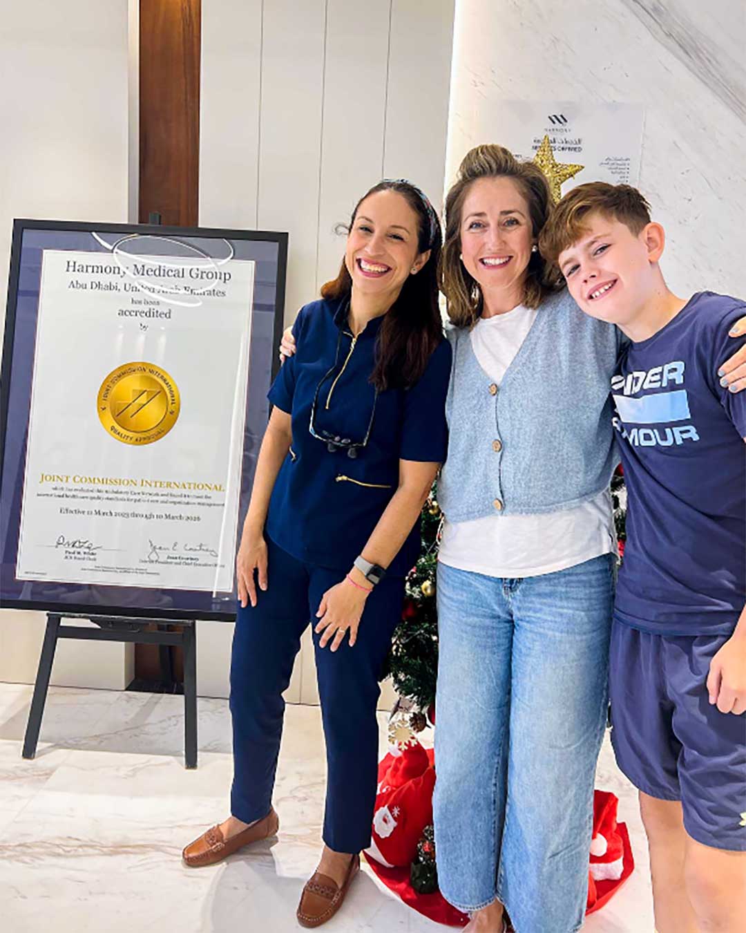 A photo of Dr. Manuela Noia with her teen patient and the mom at Harmony Medical Center in Jumeirah