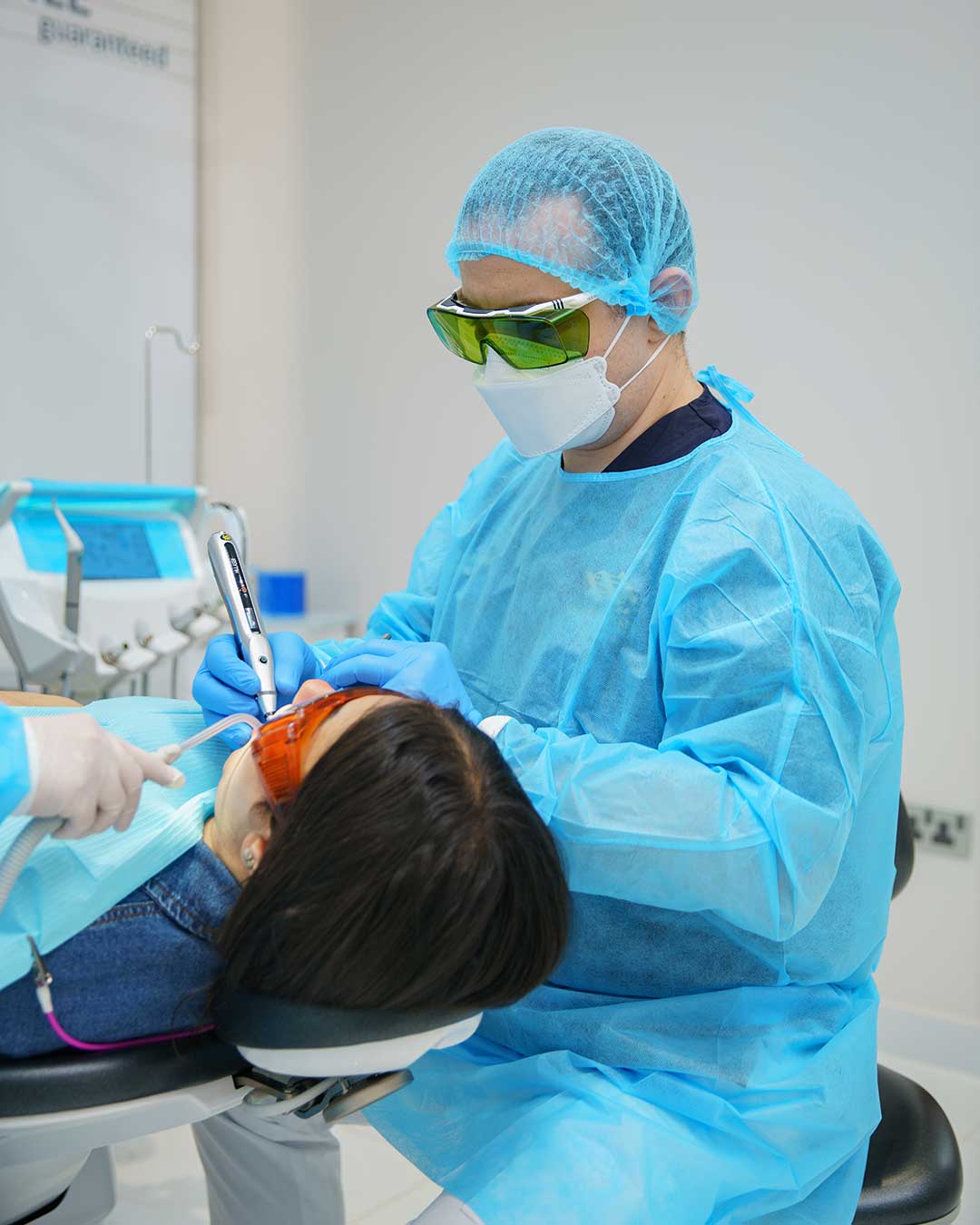 Specialist Periodontist at Harmony Medical Center treating a patient for gum recession