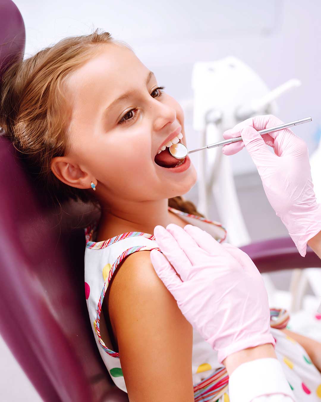 Happy and relaxed young girl smiling after treatment at Harmony Medical Center.